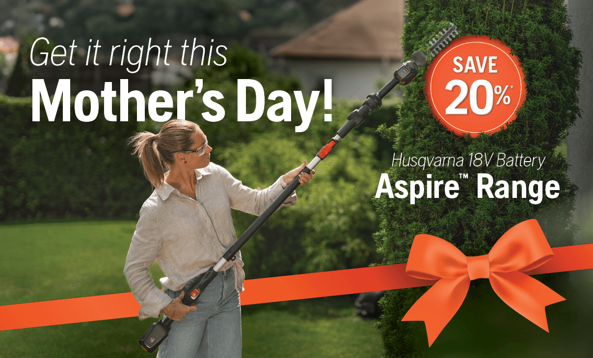 man holding chainsaw whilst cutting tree